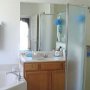 The Master Bedrooms ensuite bathroom features a shower, bath and private toilet.
