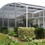 The pool area is surrounded by beautifully tended foliage.