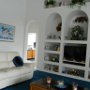 The main living room area features 2 comfortable sofa's and a widescreen cable television. It also has direct access to the pool deck.